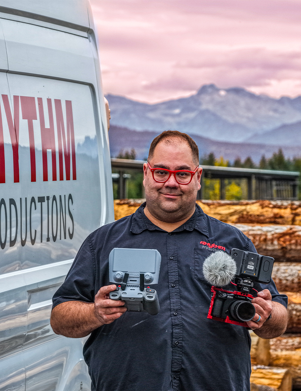 Mike Babott of Rhythm Productions with drone and camera equipment in front of production van, Armstrong BC